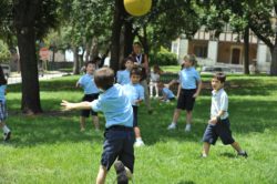 Students throw a ball back and forth