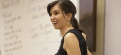 A teacher makes a surprised facial expression to the class